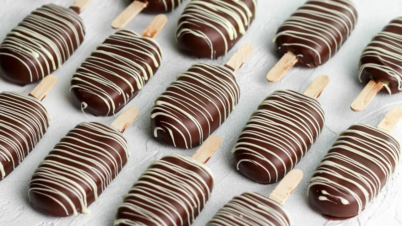 Chocolate biscuit stick cakes: moist, with cream cheese frosting and crunchy chocolate glaze.