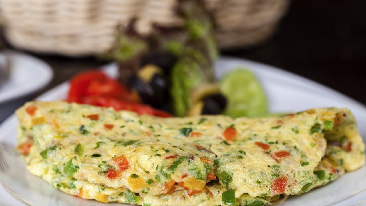 Nopea ja helppo resepti munakokkelille, jossa on kesäkurpitsaa ja iberiankinkkua.