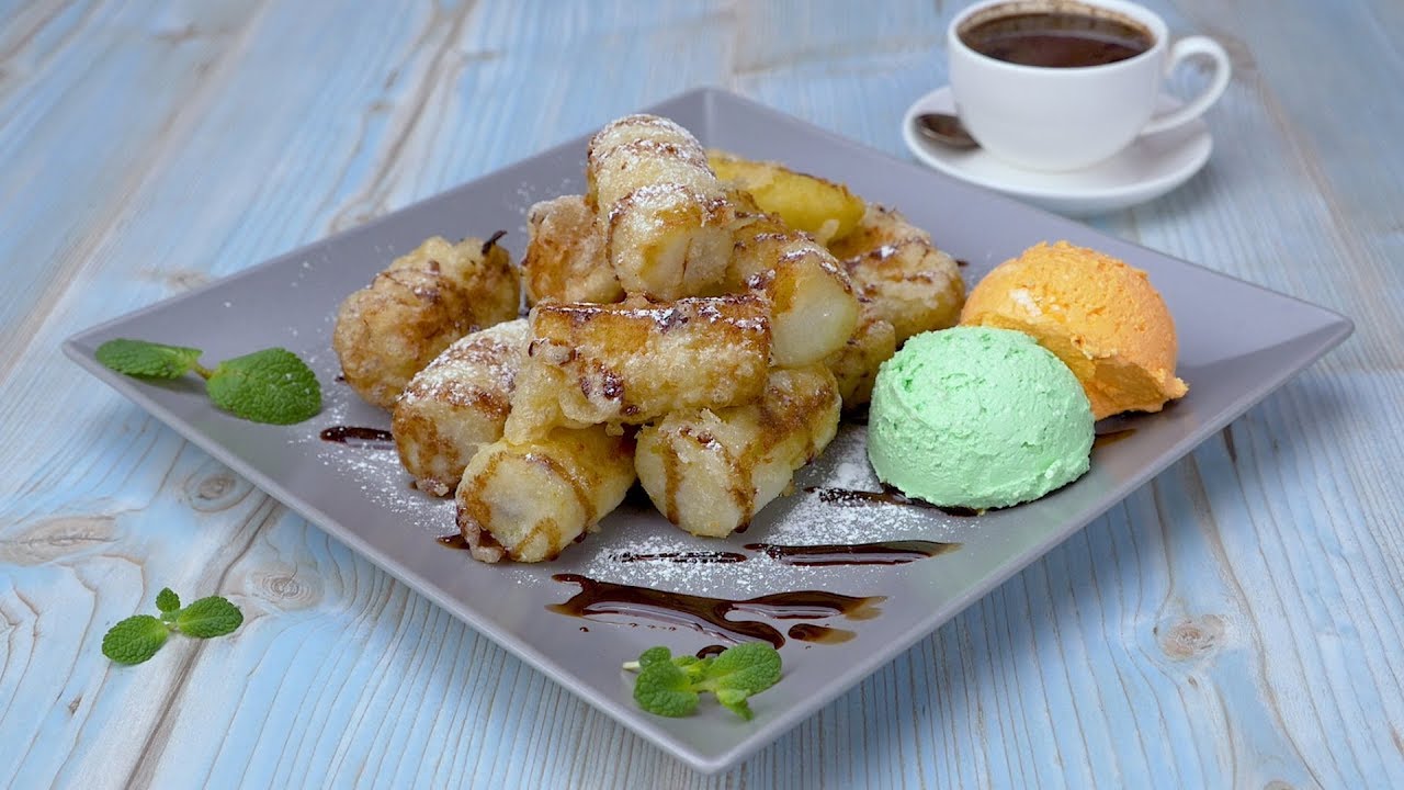 Tylsien pannukakkujen sijaan otamme banaanin ja paistamme teelle herkullisen herkkuvuoren: pehmeitä, pulleita pyöreitä leivonnaisia, joissa on herkullinen täyte.